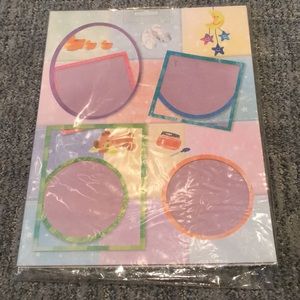 NWOT a dozen scrapbook pages with a baby theme.